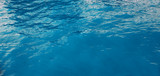 Blue cyan water in pool sea as natural texture summer background