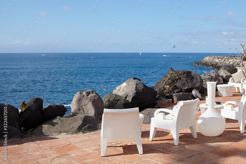 Sun loungers of the beach at sea vacation
