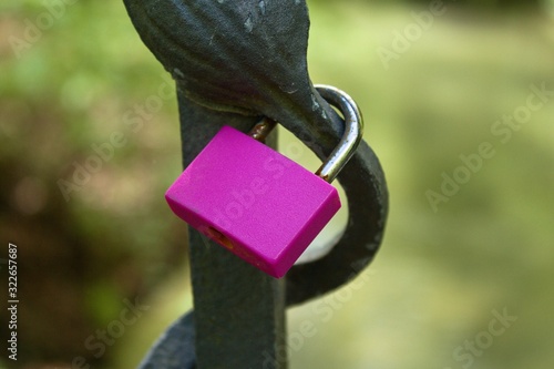 Love lock locks hang from a bridge