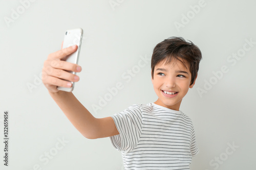 Cute little boy taking self...