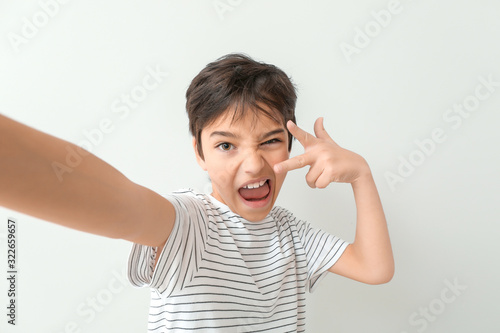 Cute little boy taking self...