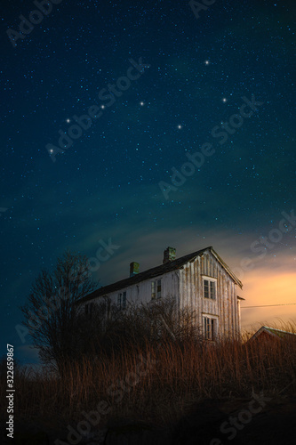 Horizontal Lanscape picture of an old house in the night sky