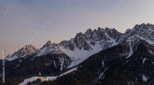 Dolomites Mountain in winter, by San Candido, Alto Adige Italy. Sunrise in Monte Baranci Haunold. Aerial drone shot in january 2020