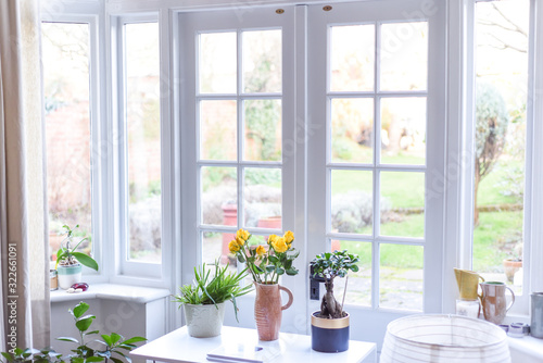 Stylish room interior with french doors and light neutral colours in a modern home