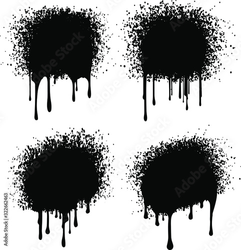 Set of 4 black grunge decors with paint drips and spray blobs. Vector illustration for your design.