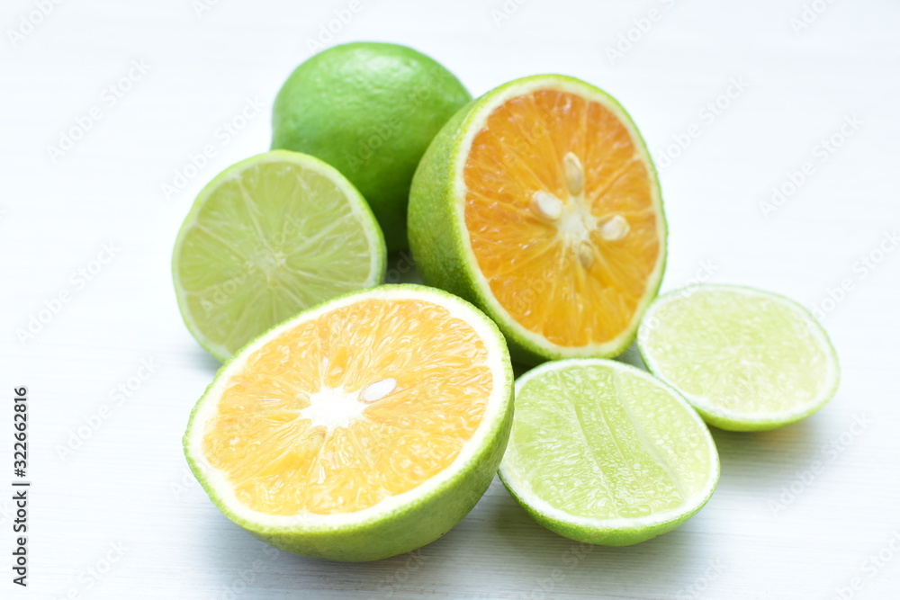 Tahiti lemons and whole and sliced oranges Tahiti lemons and whole and sliced oranges