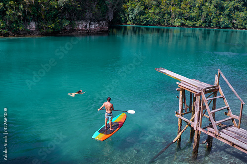 SUP boarding. Sugba lagoon, tourists attraction. Beautiful landscape with blue sea lagoon, National Park, Siargao Island, Philippines.