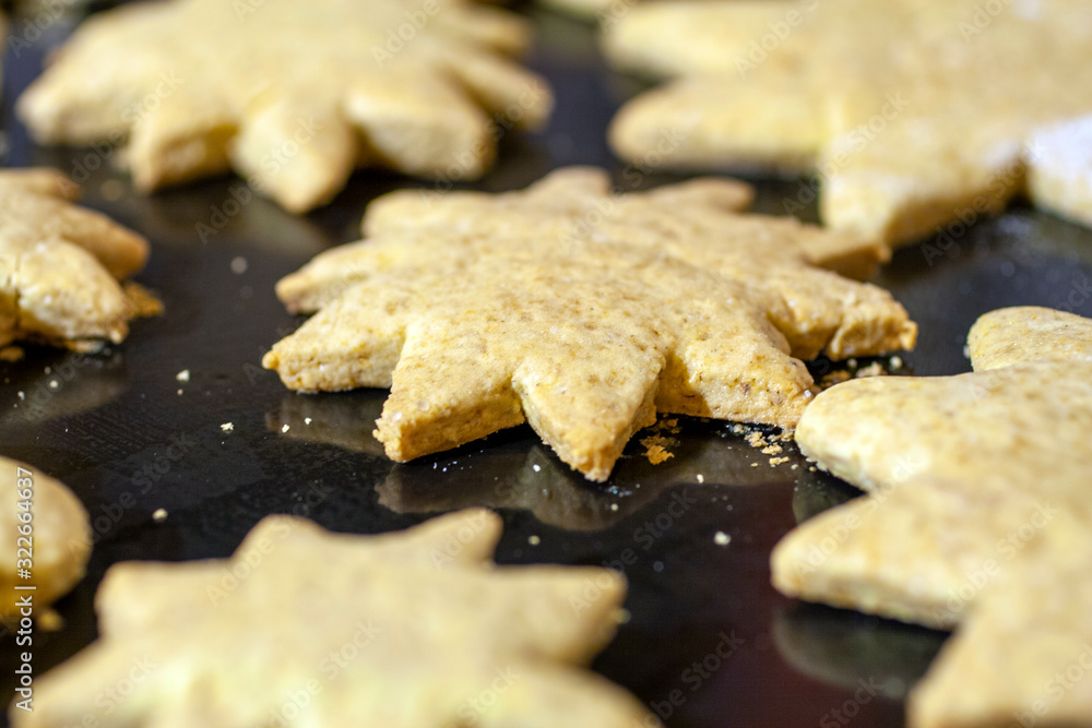 Close up shot of star shaped cakes on an owen tray Close up shot of star shaped cakes on an owen tray
