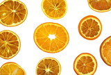 Dried orange slices from above on white background 