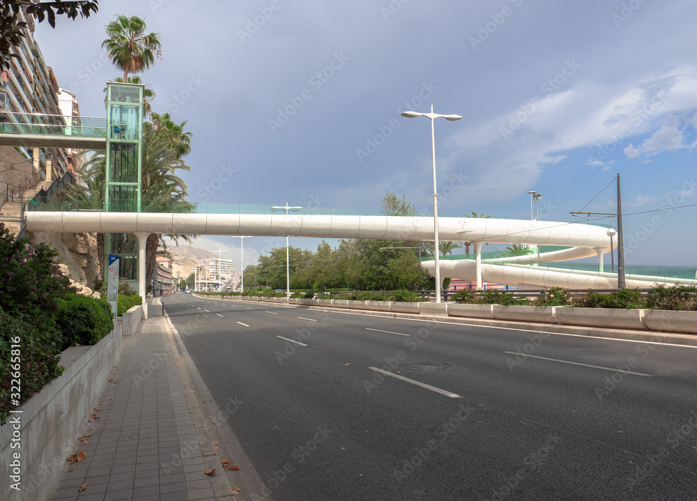 futuristic white bridge for pedestrian and cycle crossings on the Alicante seafront.Costa Blanca, Spain