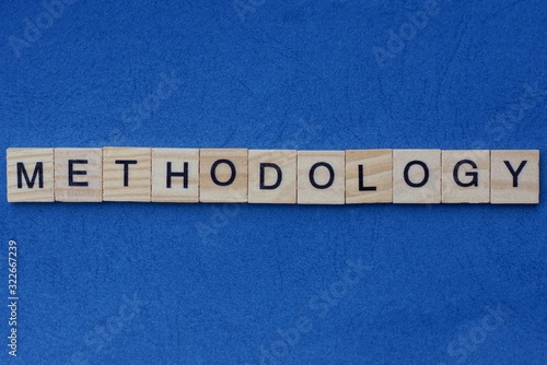 Canvas-taulu gray word methodology from small wooden letters on a blue table