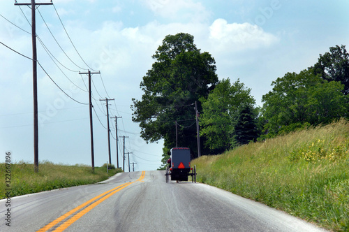 Amish Buggy Drives Down a Country Highway WFT photo