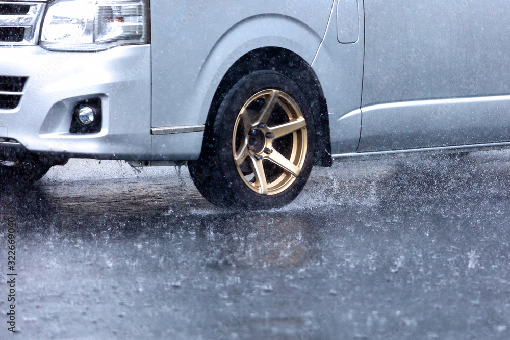 motion car rain big puddle of water spray from the wheels motion car rain big puddle of water spray from the wheels