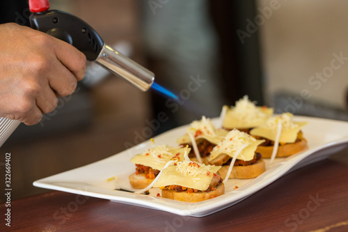 A cheff burner torch over snacks photo