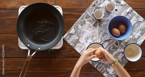 Top view food. Cooking With Mother. Beautiful Little Girl Learns How To Make Fried Egg.