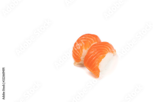 Sushi Salmon, The Japanese traditional food rice ball with fresh salmon fish slice on top. On white clear background with studio light.