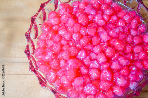 TubTimKrob is the waterchestnut in coconut milk Thailand dessert. It's vintage crispy traditional dessert eat with ice, syrup or milk in summer season. photo