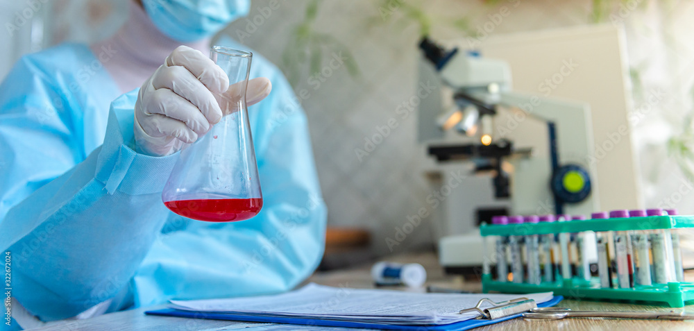 A doctor is looking for a coronavirus vaccine in his laboratory. A doctor is looking for a coronavirus vaccine in his laboratory.