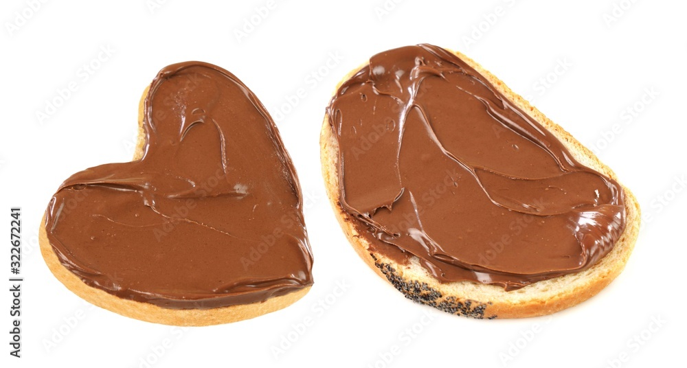 Chocolate nougat cream spread on bread slices . Isolated on white background. Chocolate nougat cream spread on bread slices . Isolated on white background.