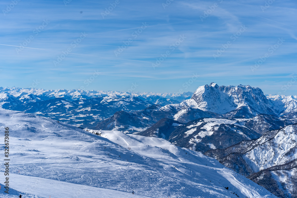 beautiful panoramic view over the Austrian Alps t, blue sky with some clouds