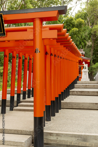 Torii gates of Ikuta Inari shrine in Kobe  Japan． photo