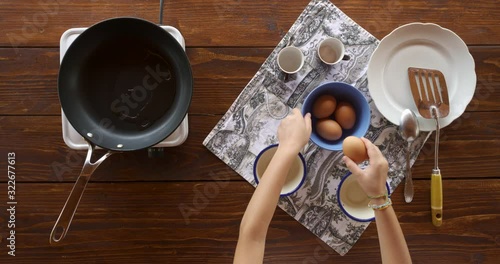 Top view food. Cooking With Mother. Beautiful Little Girl Learns How To Make Fried Egg.