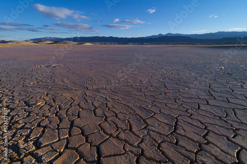 Lake Tecopa in Inyo County, Southern California. During wet years rain temporarily floods the area. In late spring most of the water evaporates forming soft cracked mud.