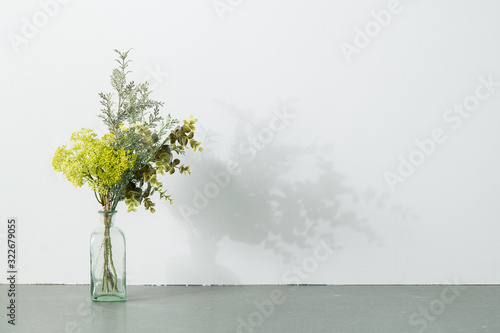 Bouquet in vase on white background. Modern lifestyle concept.