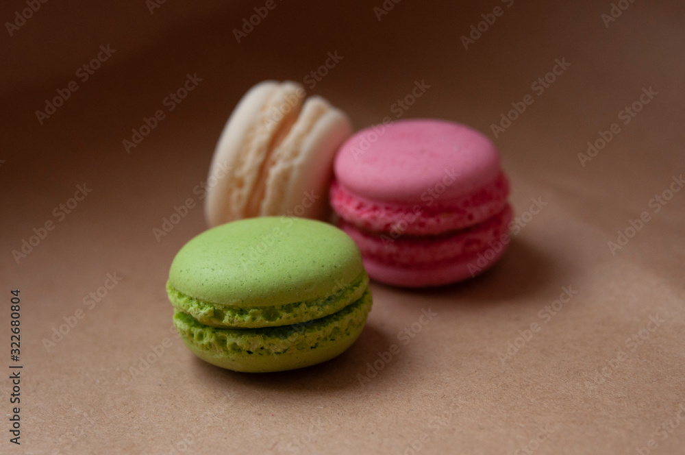 Macaroons different color on craft paper background Macaroons different color on craft paper background