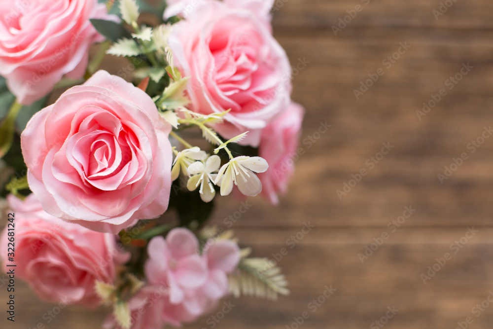 Beautiful pink roses on the old wooden table background Beautiful pink roses on the old wooden table background