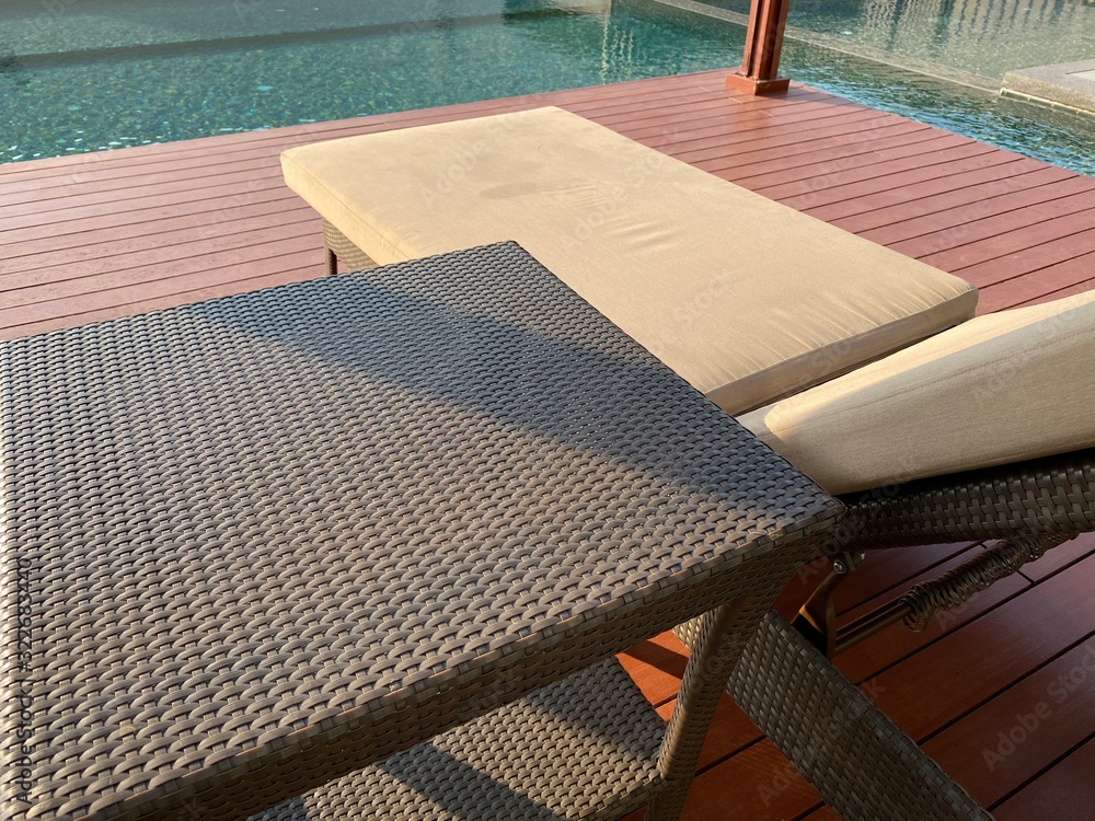 Table and chair sofa outdoor swimming pool with sunlight Table and chair sofa outdoor swimming pool with sunlight