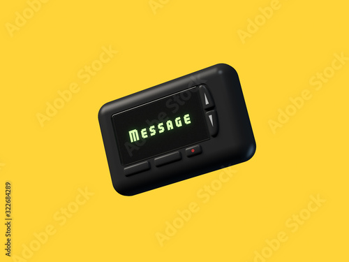 black mobile pager old technology yellow background photo