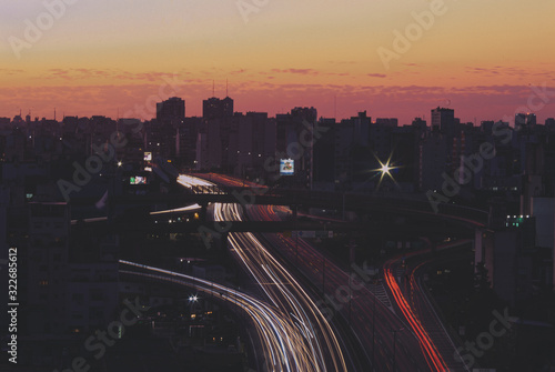  long exposure of a highway in the middle of the city in the afternoon