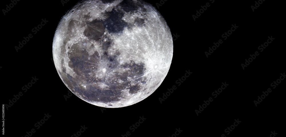 Obraz premium Full moon texture / It is the fifth-largest satellite in the Solar System, and by far the largest among planetary satellites relative to the size of the planet that it orbits.