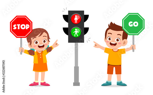 happy cute kid boy and girl with traffic sign