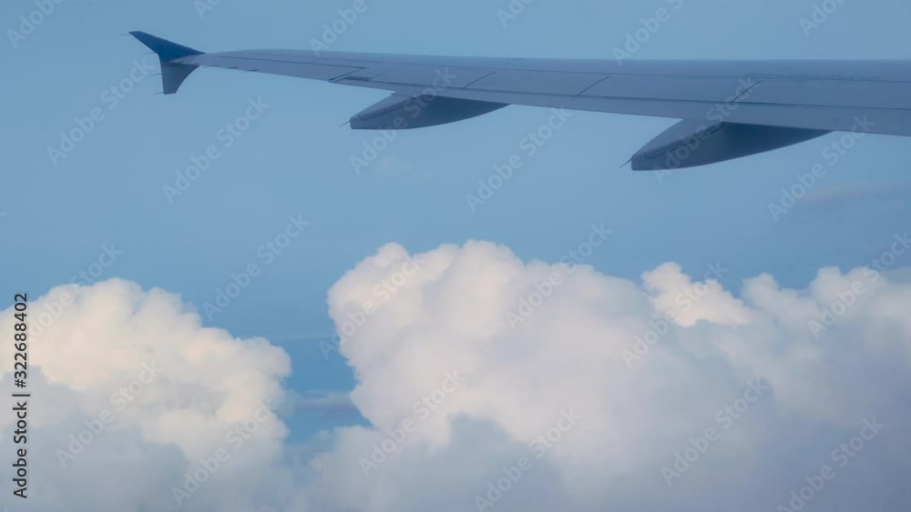 Flying Through Clouds From an Airplane Window With Clouds during Travel on a Flight Flying Through Clouds From an Airplane Window With Clouds during Travel on a Flight