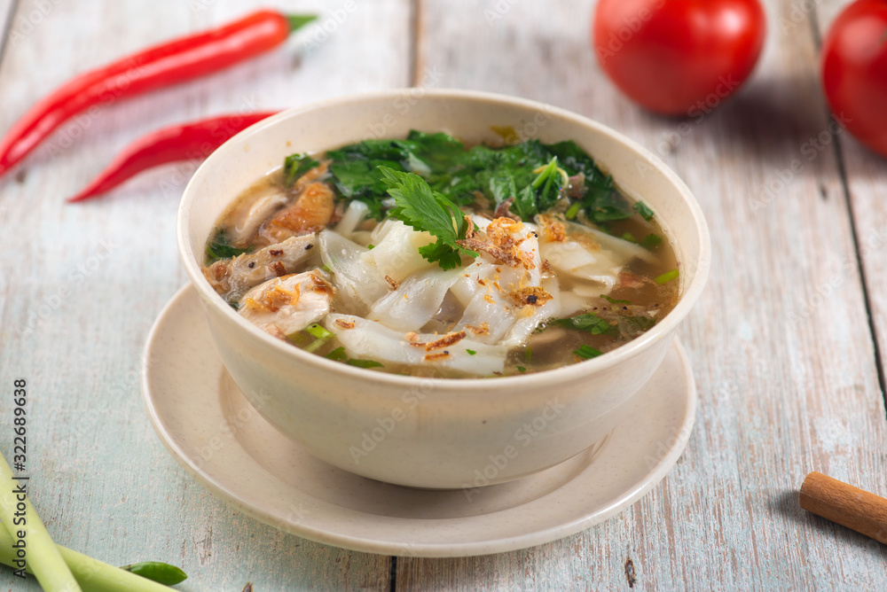 keow teow sup or ladna flat noodles soup in traditional malay style