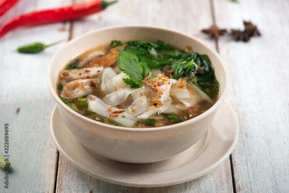 keow teow sup or ladna flat noodles soup in traditional malay style