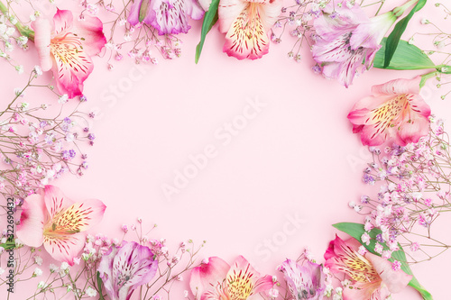 Floral composition. FLowers border frame with  gypsophila and alstroemeria. Flat lay, top view, copy space, mock up.