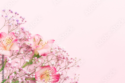 Floral composition. FLowers border frame with  gypsophila and alstroemeria. Flat lay, top view, copy space, mock up.