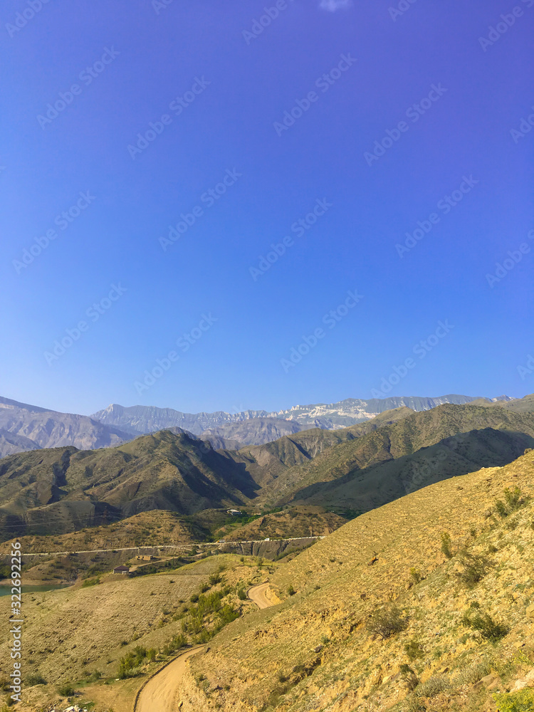 Caucasus mountain against the blue sky. Dagestan. Trees, rocks, mountains. Mountain landscape Caucasus mountain against the blue sky. Dagestan. Trees, rocks, mountains. Mountain landscape