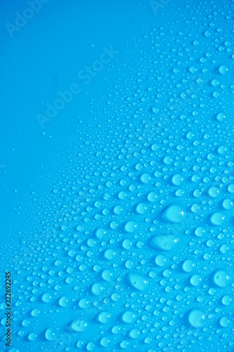 Water Drops On Blue Background.