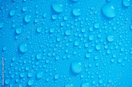 Water Drops On Blue Background.