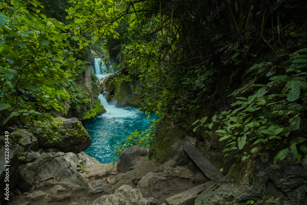 Wild river stream rocks flowing. Forest river rocks view in Tamasopo san luis potosi mexico Wild river stream rocks flowing. Forest river rocks view in Tamasopo san luis potosi mexico