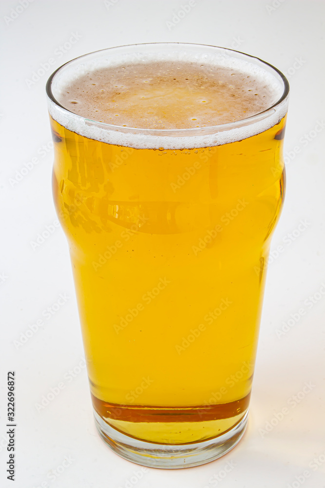 An isolated beer pint on a white background An isolated beer pint on a white background