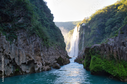 River and amazing crystalline blue water of Tamul waterfall in San Luis Potosí, Mexico photo