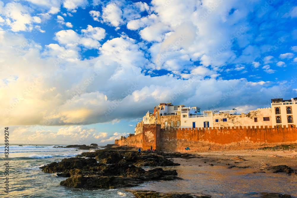 Ancient walls of the medina in Essaouira at sunset clouds, photographed using a polarizing filter