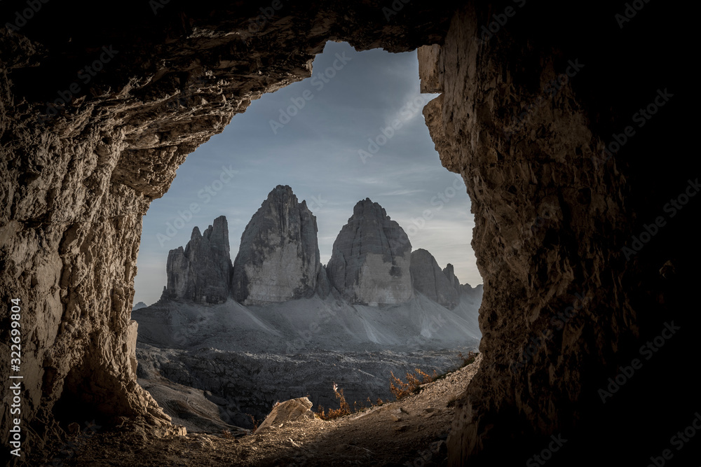 Fototapeta Dark landscape of maountains seen from the cave