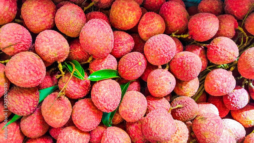 Lychees, fresh lychee looks red skin with green leafs Lychees, fresh lychee looks red skin with green leafs