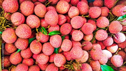 Lychees, fresh lychee looks red skin with green leafs